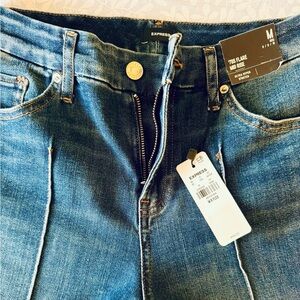 Express Mid Rise Wash Pintuck Raw Hem FlexX ‘70s Flare Jeans